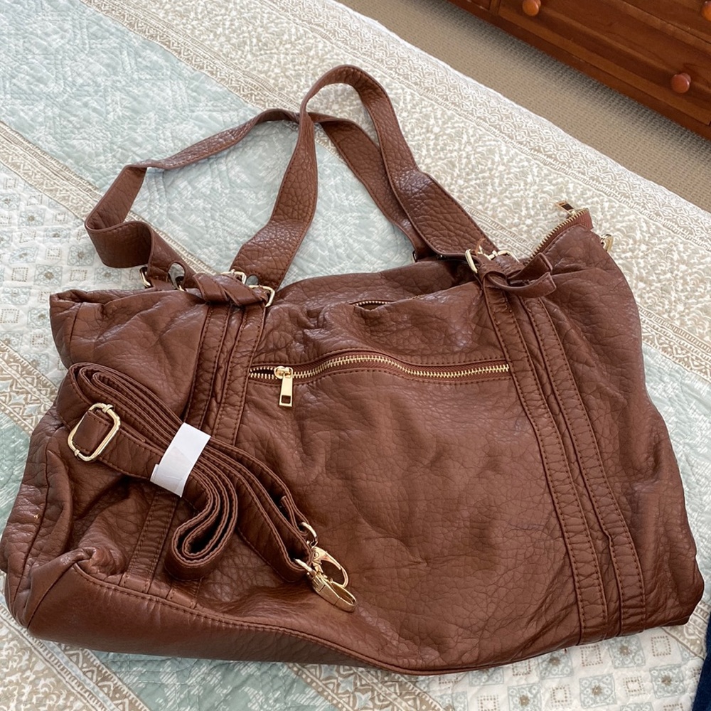 Large, brown shoulder purse with long strap to make into a cross body purse